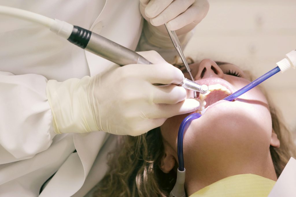 A patient at All Smiles Dental learning the benefits of a regular dental checkup in Des Moines.
